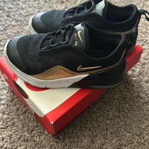 Black and gold Nike sneakers kids unisex